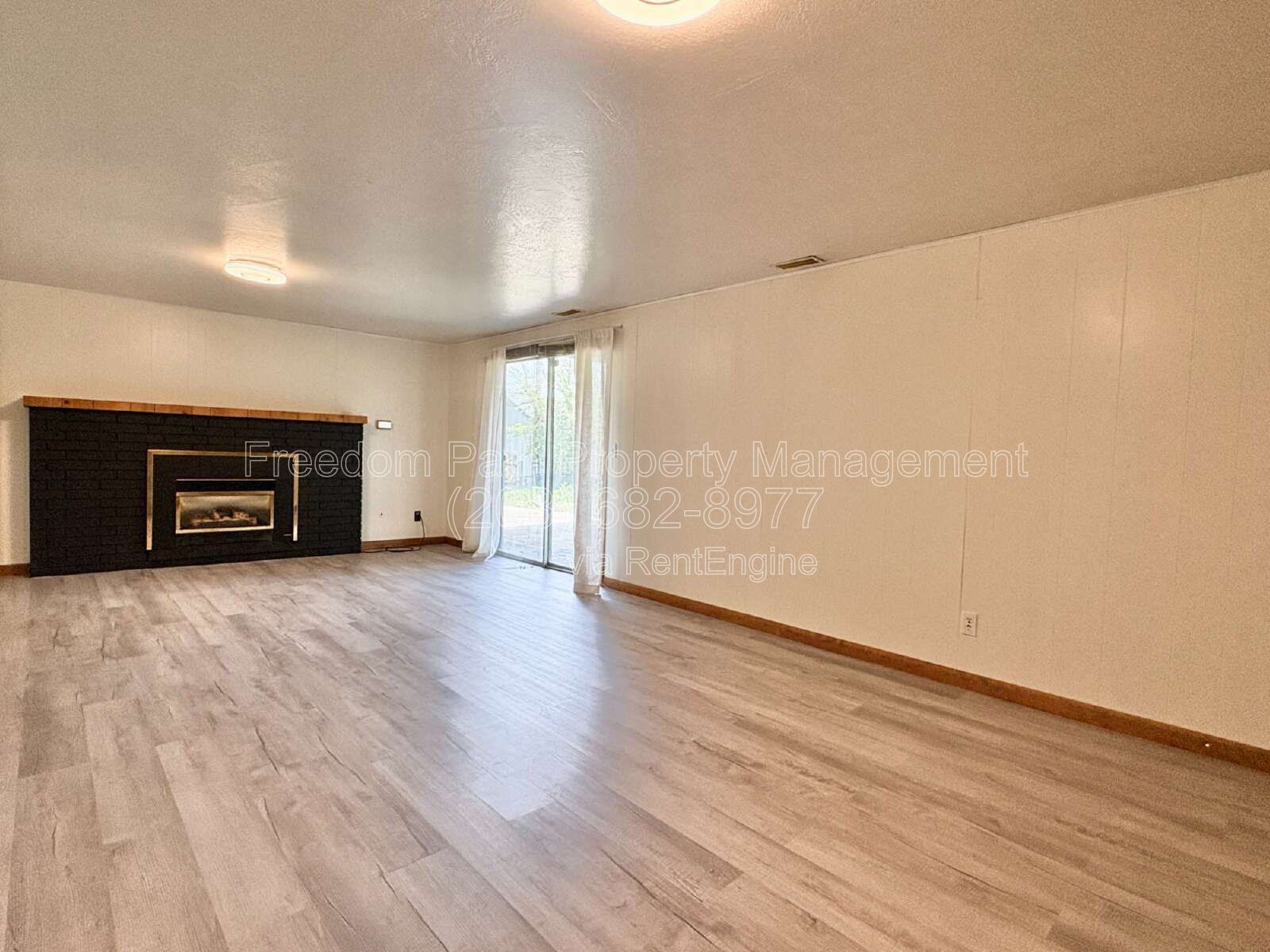Spacious 4 Bed + Flex Space Coeur d'Alene Home | 2,640 Sq Ft, Beautifully Updated, Large Deck with Views, Carport & Great Location property image