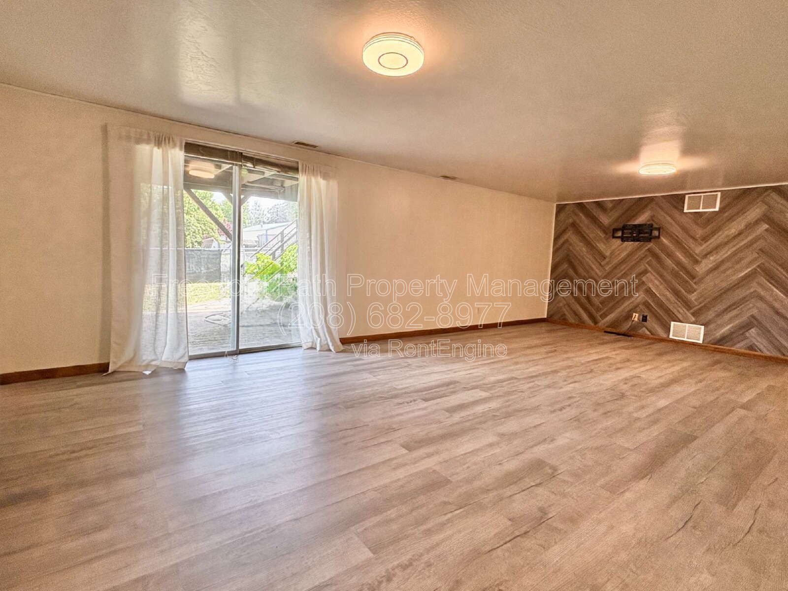 Spacious 4 Bed + Flex Space Coeur d'Alene Home | 2,640 Sq Ft, Beautifully Updated, Large Deck with Views, Carport & Great Location property image