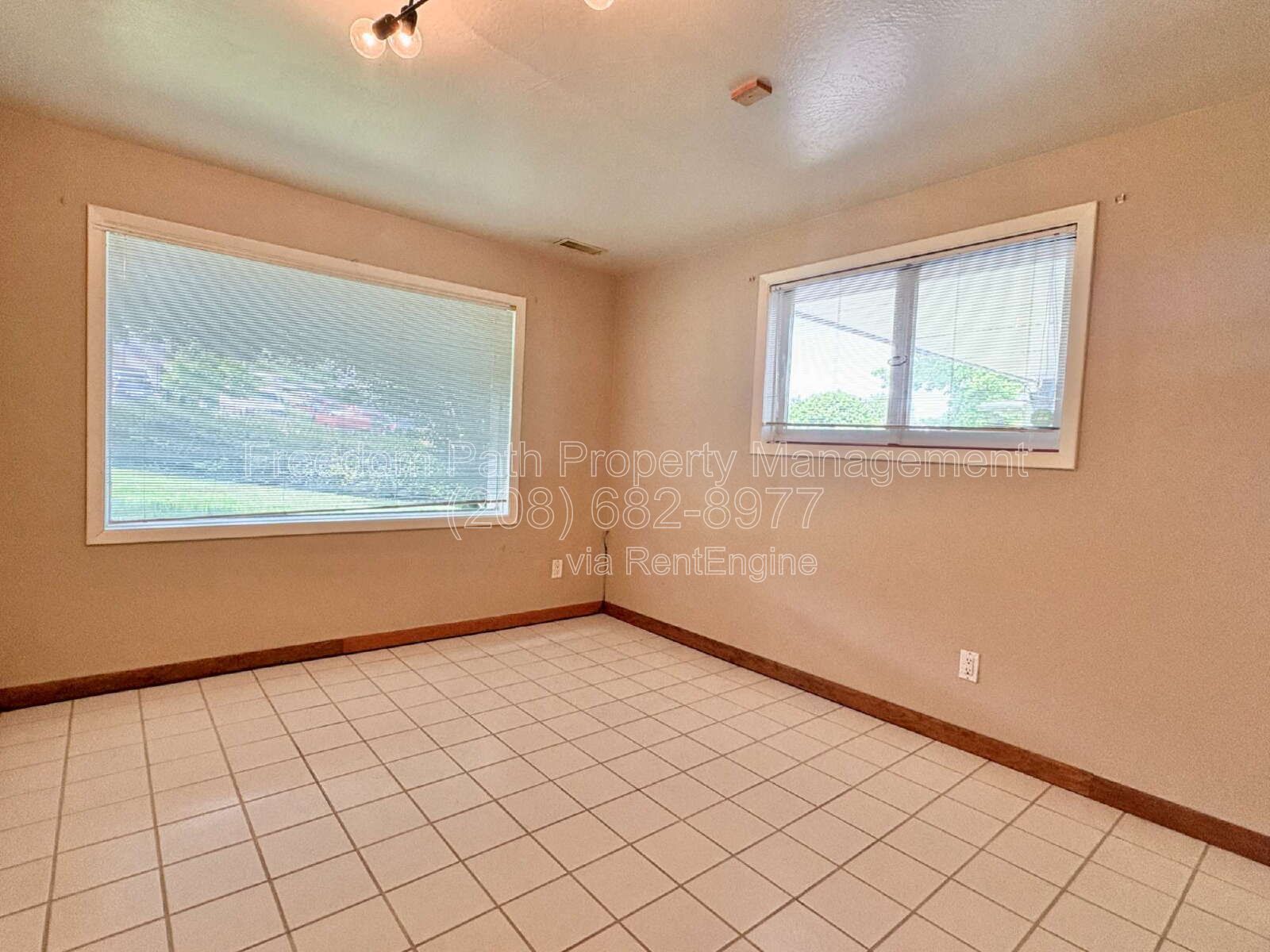 Spacious 4 Bed + Flex Space Coeur d'Alene Home | 2,640 Sq Ft, Beautifully Updated, Large Deck with Views, Carport & Great Location property image