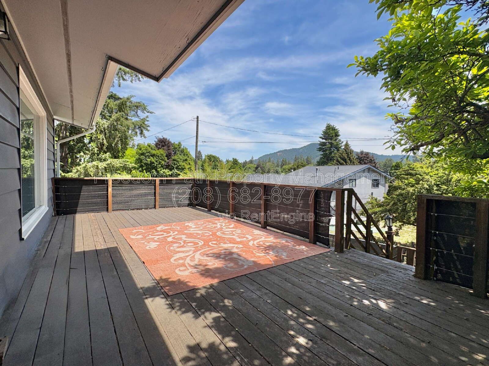 Spacious 4 Bed + Flex Space Coeur d'Alene Home | 2,640 Sq Ft, Beautifully Updated, Large Deck with Views, Carport & Great Location property image